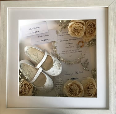 memory box of wedding items such as flower girl shoes, tiara and preserved wedding bouquet flowers