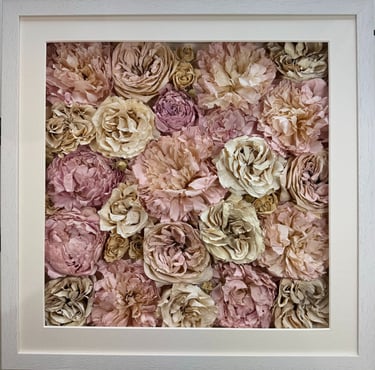 a photo of a flower wall style preserved wedding bouquet in a frame