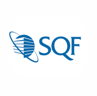 Business owner shaking hands with manufacturer representative, signifying successful partnership.