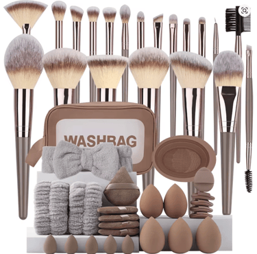 Professional makeup brush set with sponges, headband, and travel wash bag in neutral tones.