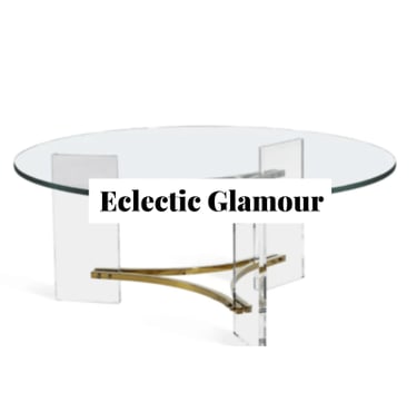a round, modern lucite coffee table with brass details