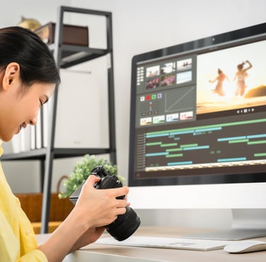 a woman in a yellow shirt is holding a camera and taking a picture of a