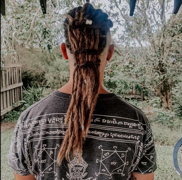 a man with dreadlocks and dreadlocks on his hair