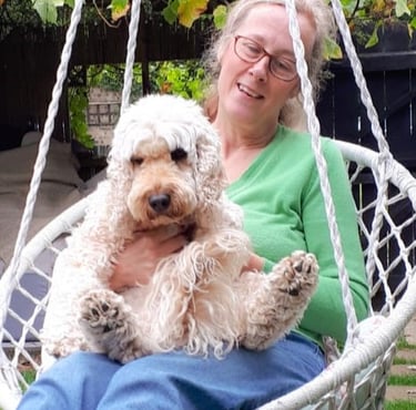 Tracy with Penny, swinging in a chair, Risca, Newport, South Wales, UK.