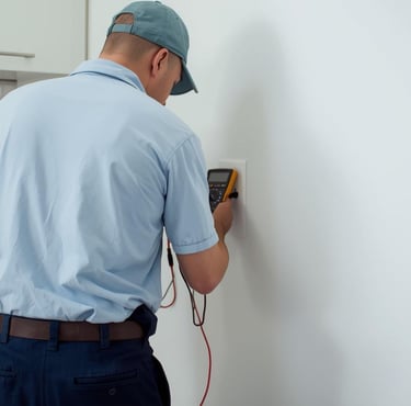 an electrician changing a socket