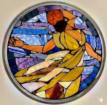 Circular stained glass mosaic titled "Isadora" by Julie Curson, depicting a graceful figure.