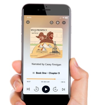 a person holding a cell phone in their hand listening to an audiobook narrated by casey finnigan