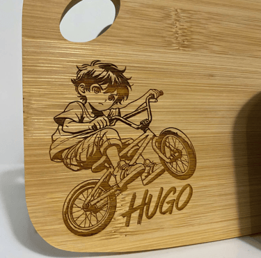 a wooden cutting board with a wooden cutting board with a boy on it