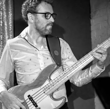 Black and white photo of Hank playing bass.