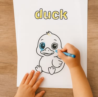 a child's hand is coloring in a duckling