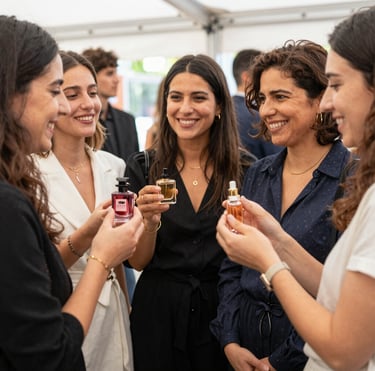 A close-up of elegant perfume miniatures arranged on a wooden surface with soft natural light.