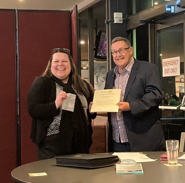 Tracy being congratulated during her induction as a new member of Rotary Club of Queanbeyan