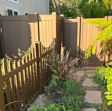 Custom chestnut brown vinyl picket and gates.