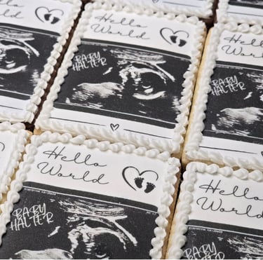 Handcrafted baby birth announcement cookies decorated with personalized details, perfect for celebrating a newborn