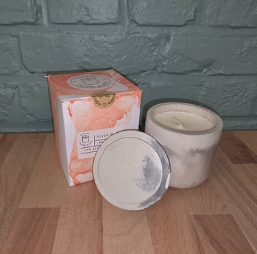 a candle with a candle in a box