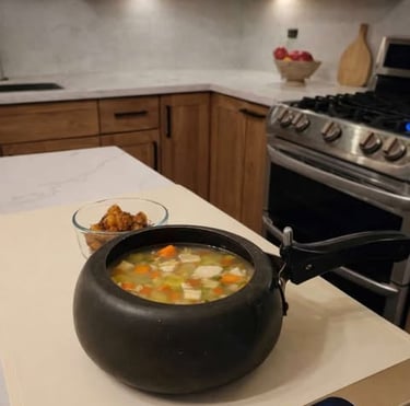 Electric heated mat with chicken vegetable soup on a kitchen island, warming meal indoors
