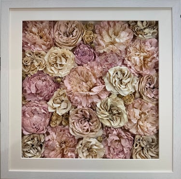 a photo of a flower wall style preserved wedding bouquet in a frame