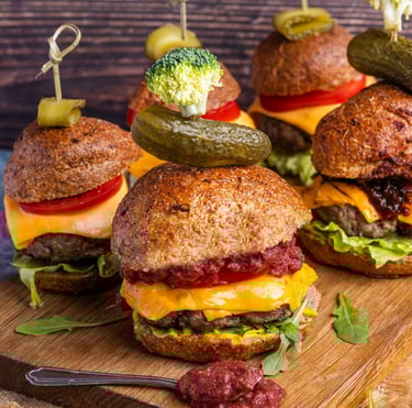 Sustainable plant-based, nutritionally-dense, hypoallergenic protein and fibre burgers displayed on a wooden board