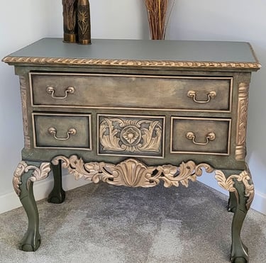A Chippendale repro painted in different tones of green layers with gold highlights to the detail