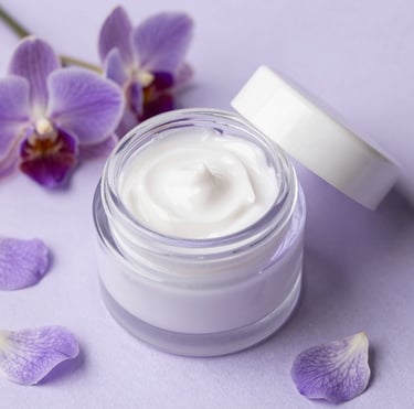 A close-up of fresh lavender and eucalyptus leaves intertwined on a rustic wooden table.