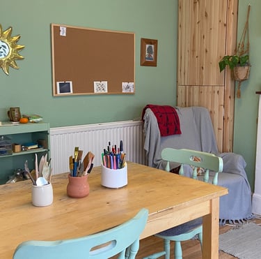 A photo of an art room with worktable