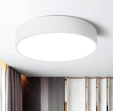  Minimalist white wall-mounted light fixture for soft bedroom illumination.