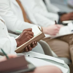 a doctor's hand holding a clipboard with a clipboard