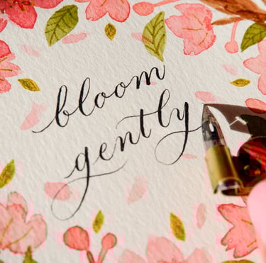 New York City Calligrapher writing inspirational quote customizing a watercolor floral painting