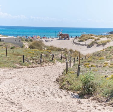 Sandy walkway to Cala Mesquida beach
