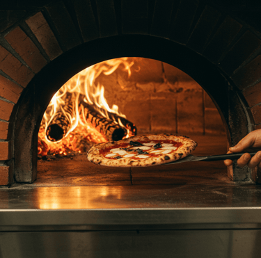 pizza coming out of Rome oven