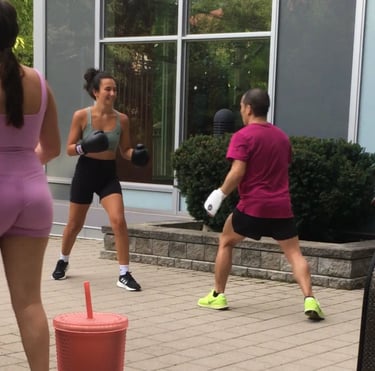 A group of people training Jeet Kune Do martial arts in a North York courtyard area.