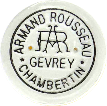 Bottle capsule of the Domaine Armand Rousseau Chambertin accounts seen from above