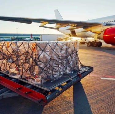 a cargo plane with a cargo truck loaded with cargo