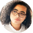 a woman with glasses and a white shirt