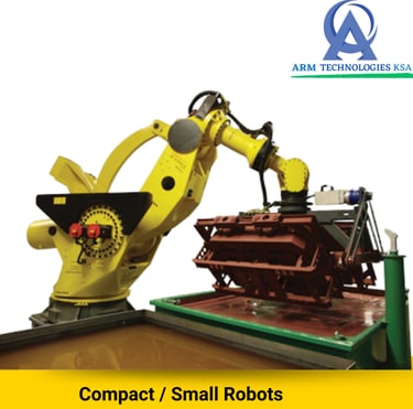 Yellow industrial robotic arm performing precision automated manufacturing for ARM Technologies KSA.