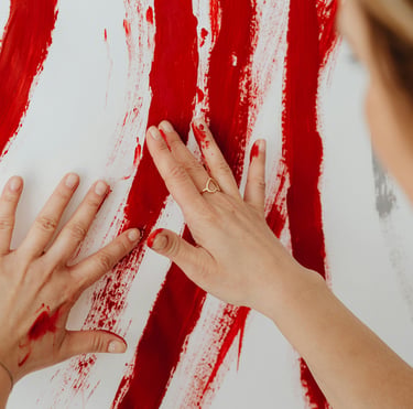 Photo of someone painting with their bare hands during a 1:1 intuitive painting session