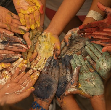 Circle of hand with paint on during an intuitive painting workshop