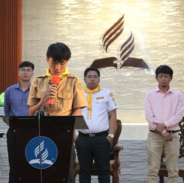 Elementary scout student speaking on a podium