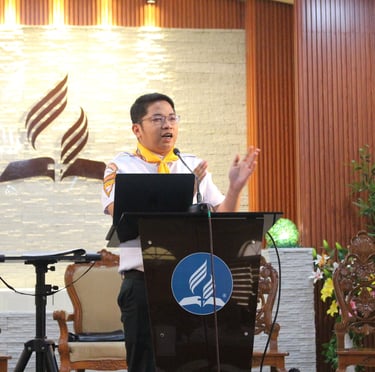  Scout leader speaking on a podium