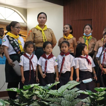 Groups of teachers and elementary students singing