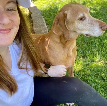 girl with a dog next to her