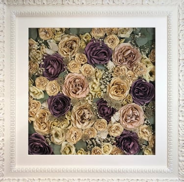 a Flower Wall Style bouquet of flowers in an ornate white frame