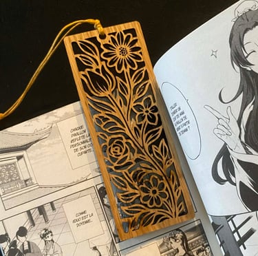 a person holding a book with a bookmark