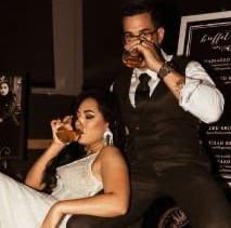 Bride and groom holding champagne glasses for toast