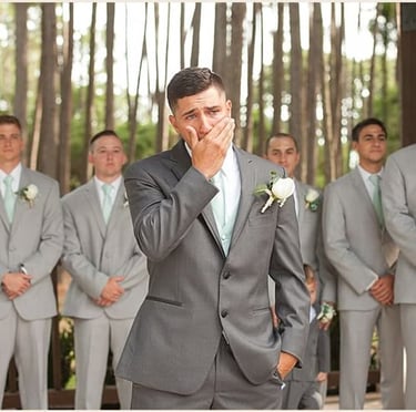 Emotional groom seeing bride for the first time
