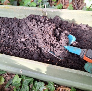 brown soil in a raised garden bed