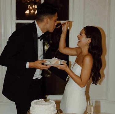 Couple cutting their wedding cake together