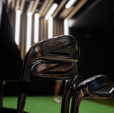 Titleist golf clubs in 1IRON indoor golf simulator venue