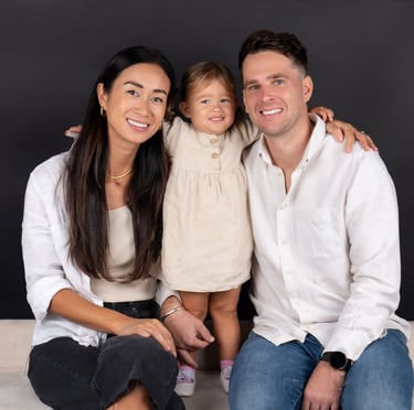 Happy family posing together in a warm and joyful photoshoot at Pixel Craft Digital Studio.