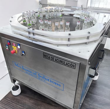 mesas de acumulacion, buffer de linea, zona de empacado de botellas